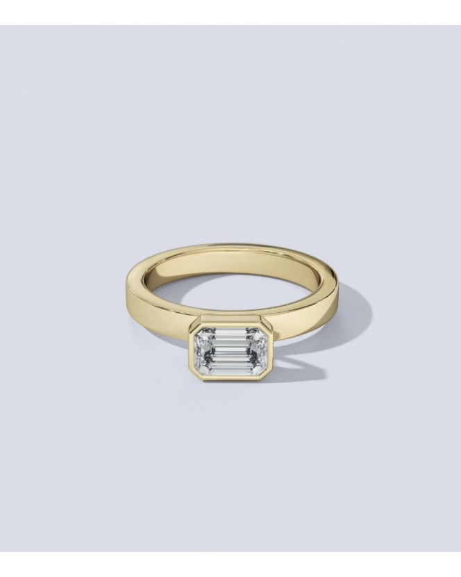 Бриллиант огранки "октагон" 5,6 x 4 мм. Желтое золото.